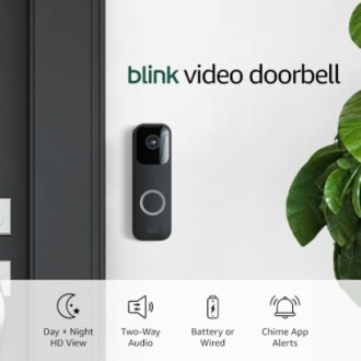 Blink video doorbell installed on a wall with features listed: day and night HD view, two-way audio, battery or wired, chime app alerts.