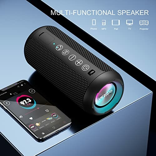 Portable Bluetooth Speaker with Colorful LED Lights next to a Smartphone