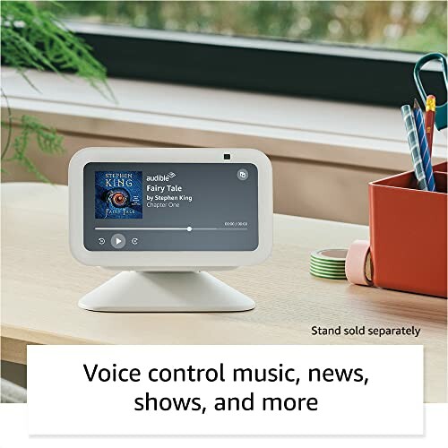 Smart display on desk showing audiobook screen.