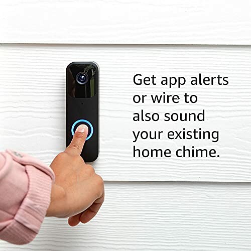 Person pressing button on smart doorbell with app alert feature.