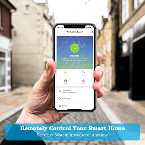 Person holding smartphone displaying smart home control app interface.