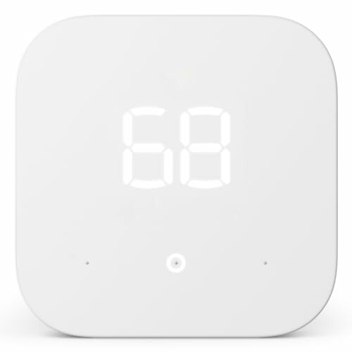 Smart thermostat with digital display showing 68