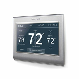 Smart thermostat showing temperature and settings screen.