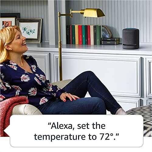 Woman using a smart speaker to set the temperature.